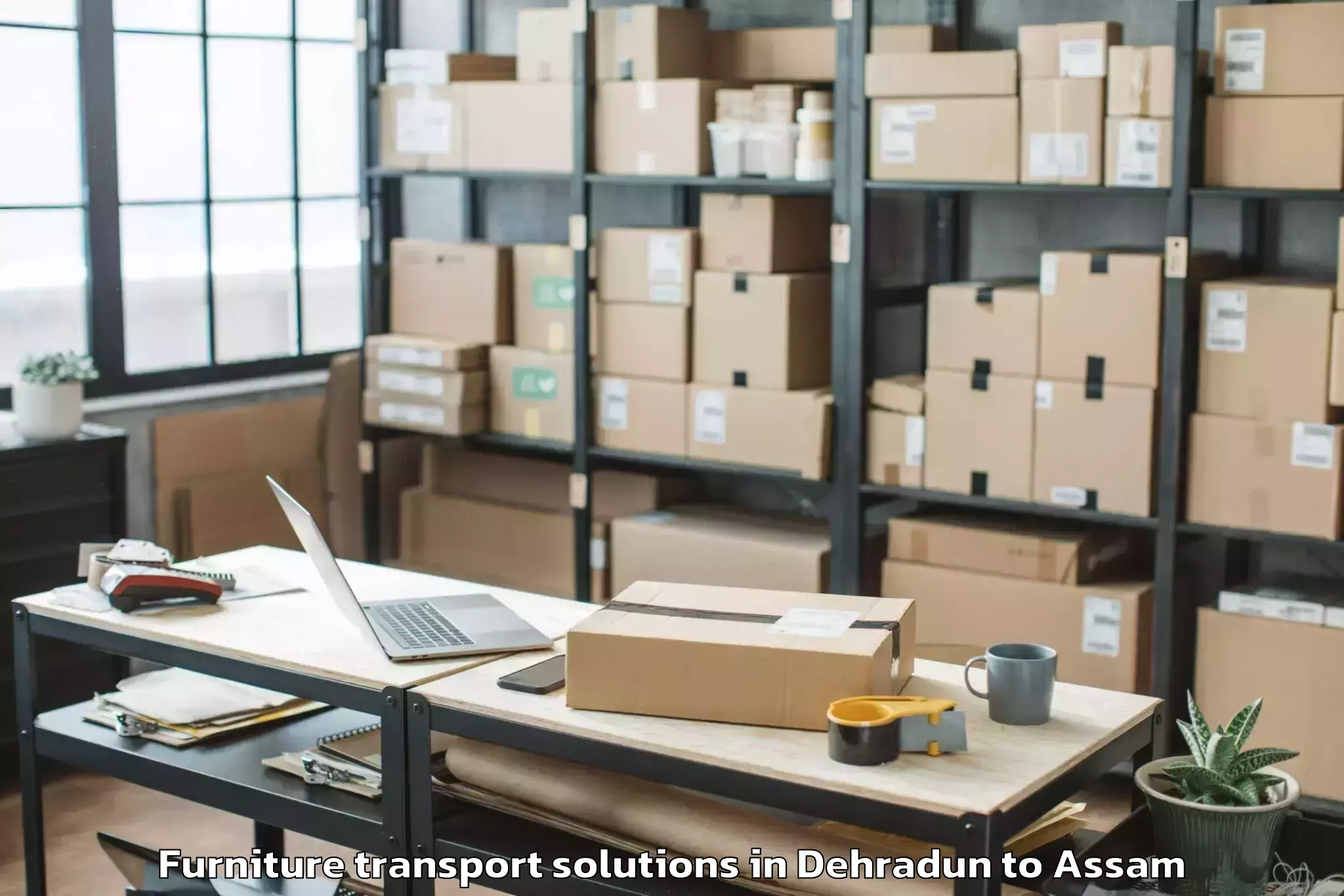 Expert Dehradun to Badarpur Karimganj Furniture Transport Solutions